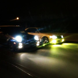 Rolling night shot of my car and my friends mini cooper